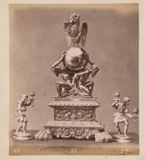 Metal cabinet ornament and two candlesticks
