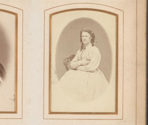 Portrait of a seated woman with ringlet curls