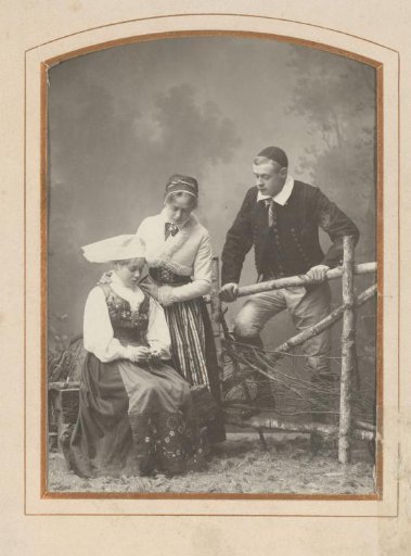 Portrait of two girls and a boy in traditional dress