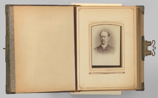 Portrait of a man with a mustache and spectacles