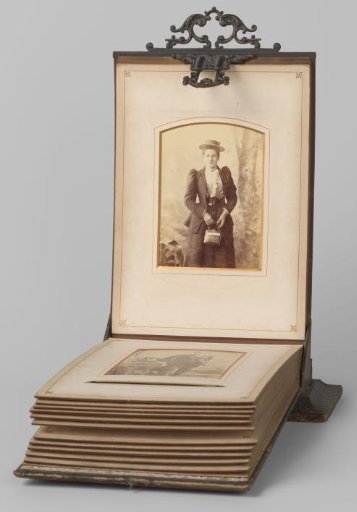 Portrait of a young woman with hat and handbag