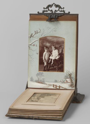 Portrait of a standing boy and a seated girl