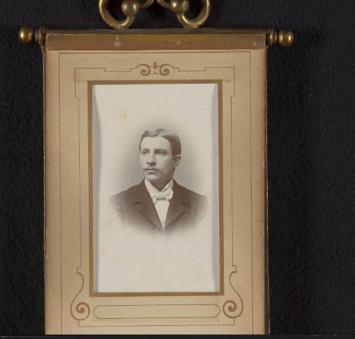 Portrait of a Young Man with a Mustache and Bow Tie