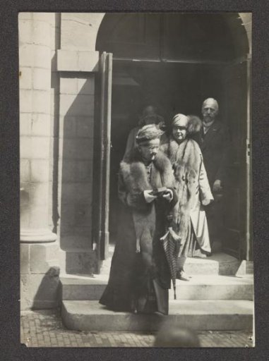 Queen Emma leaving the church with a Bible in her hand