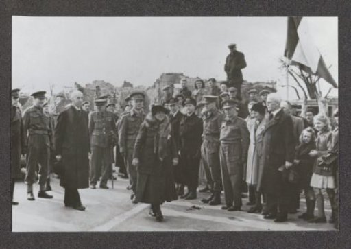 Queen Wilhelmina walks past a hedge of soldiers in March 1945 in Zeelandic Flanders