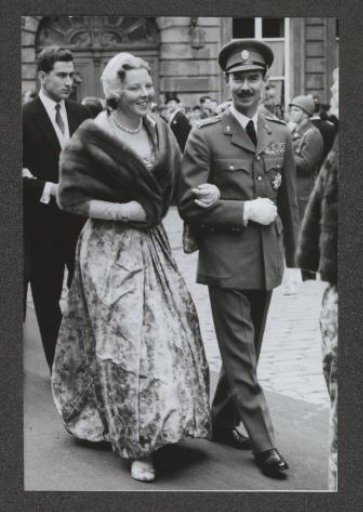 Princess Beatrix walking arm-in-arm with Prince Jan of Luxembourg during a wedding