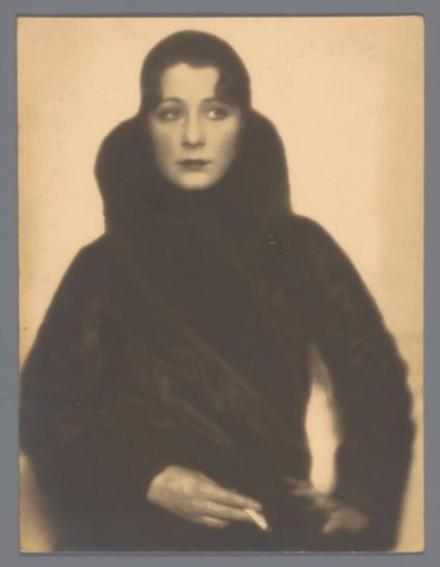 Portrait of Roly Bock, in a fur coat with a cigarette