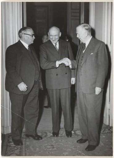 Portrait of G. Marshall, R. Schuman and E. Bevin during a meeting in Paris