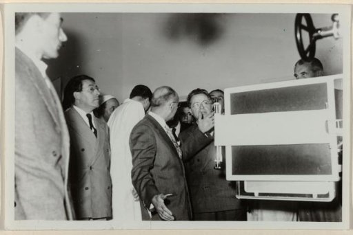 Palmiro Togliatti receives an explanation of medical equipment in a hospital in Rome