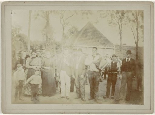 Celebrating crowd in Amsterdam, to the right of the center a man with an accordion