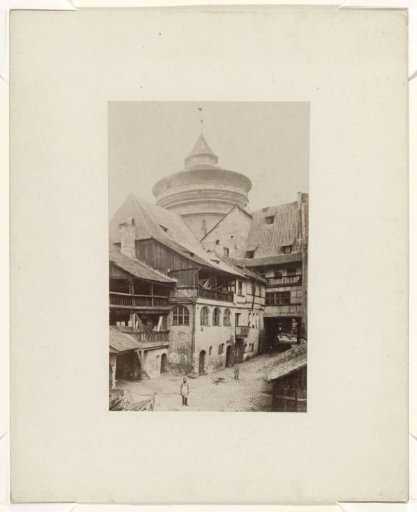 Street view in Nuremberg with tower of the city wall