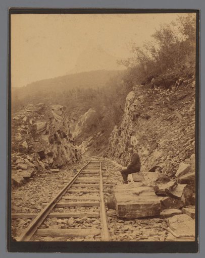 View of the Luleå - Narvik railway line (ore railway line), on the right an unknown man along the track