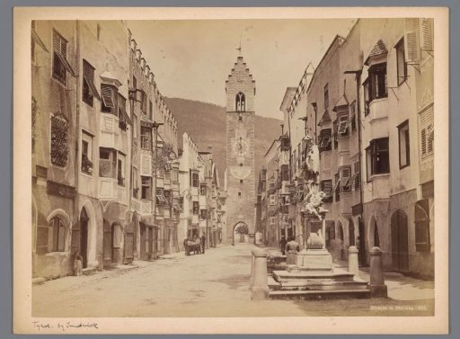 Street view in Sterzing with the Zwölferturm in the background, Italy