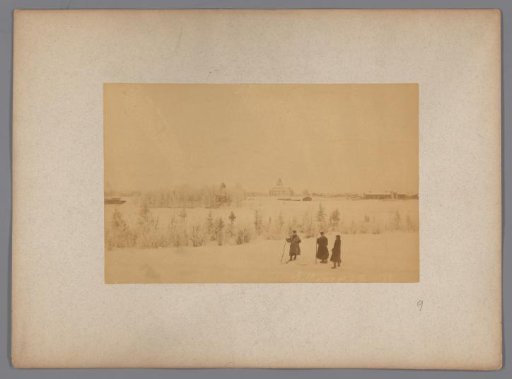 View of Gällivare in the snow, in the foreground three people