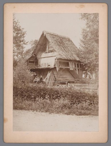 Man in front of a wooden building in Switzerland