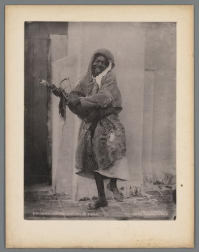 Portrait of an unknown man with a fiddle in Algiers, Algeria