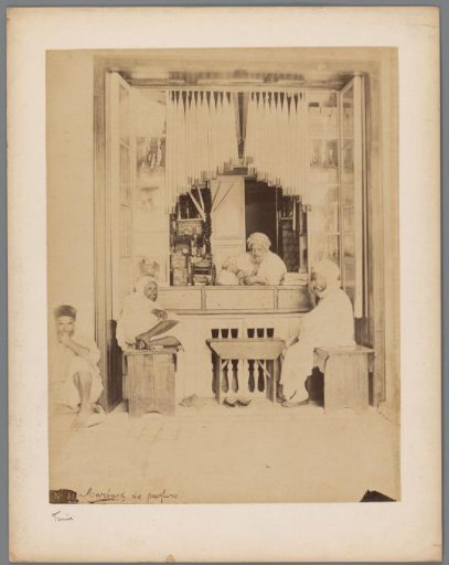 Perfume seller in his shop, presumably in Tunis
