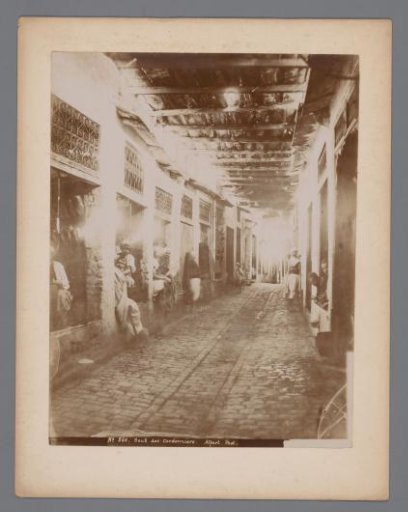 Shoemakers in a souk, presumably in the Medina of Tunis