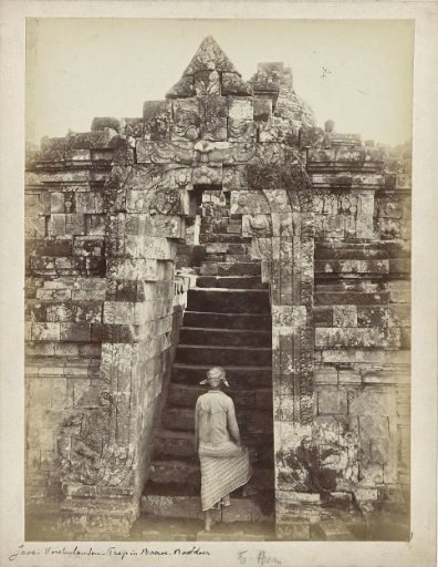Javanese man ascending one of the stairs of the Borobudur