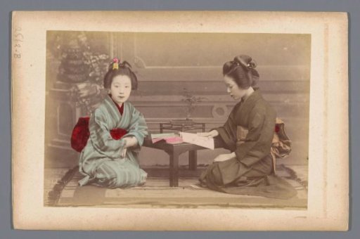Double portrait of two unknown Japanese women while reading