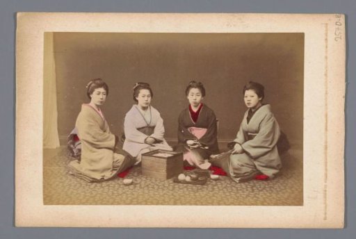 Group portrait of four unknown Japanese women at tea