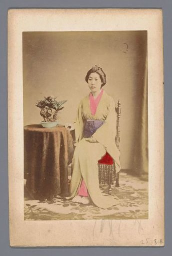 Portrait of an unknown Japanese woman at a table