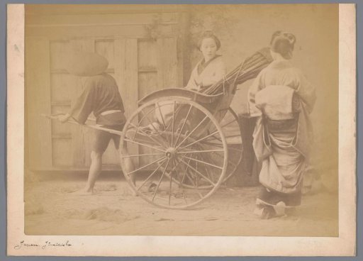 Unknown woman in a rickshaw pulled by a man, with a second woman seen from the back on the right