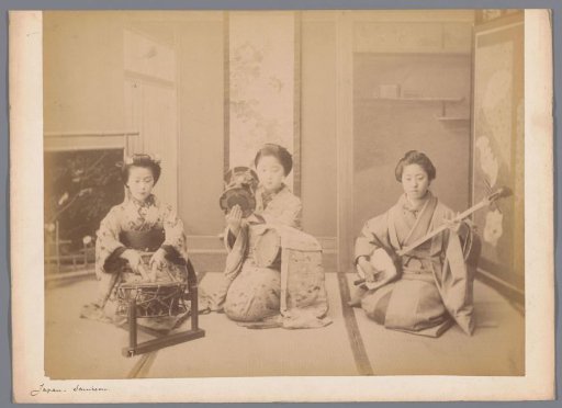 Group portrait of three unknown Japanese women with traditional Japanese instruments