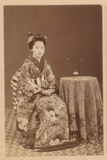Portrait of an unknown Japanese woman at a table