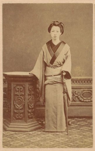 Portrait of an unknown Japanese woman with umbrella