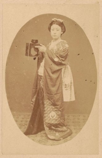 Portrait of an unknown Japanese woman with an object in her hands