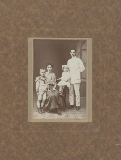 Group portrait of an unknown family consisting of a man, woman and two children, Dutch East Indies