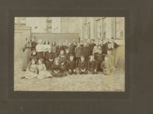School photograph of a class of children outside at school