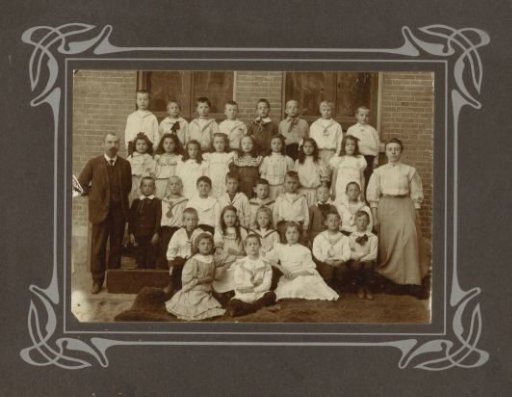 School photograph of a class with children, outside at school