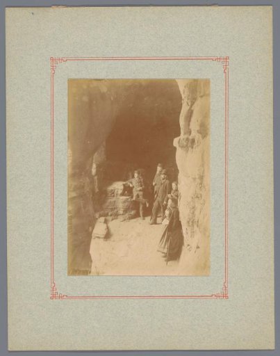Tourists at the entrance of Kohlscheuer cave near Echternach, Luxembourg