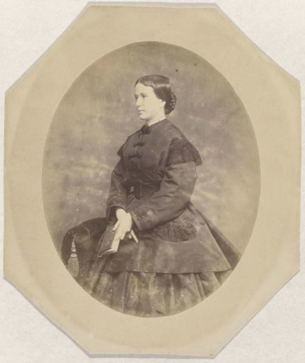 Studio portrait of a woman with a book
