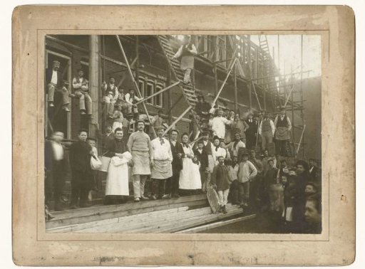 Group portrait of workers at a house under construction