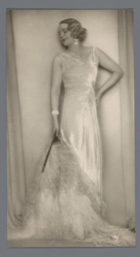 Portrait of an unknown woman with a closed fan