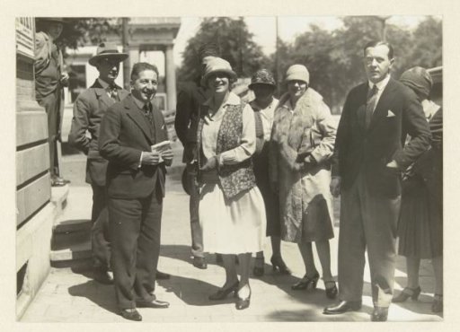 Group portrait of women and men on the street