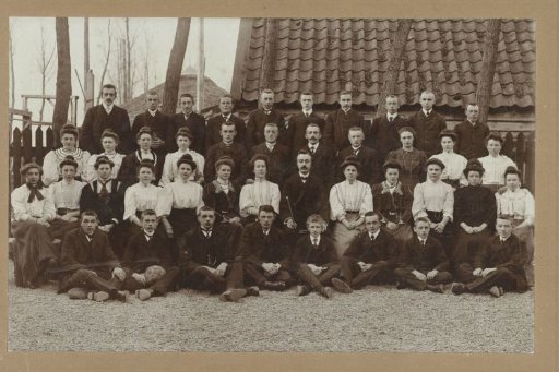 Group portrait of young men and women on a farmyard