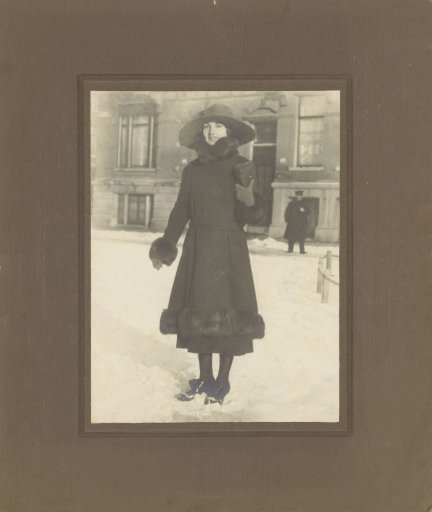 Portrait of an unknown woman with fur coat on the street