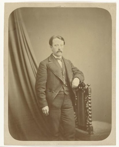 Studio portrait of a man in a black suit
