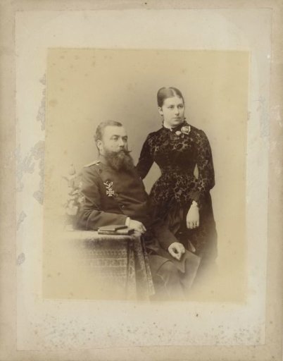 Studio portrait of a man with an order pinned to his breast and a woman at his side