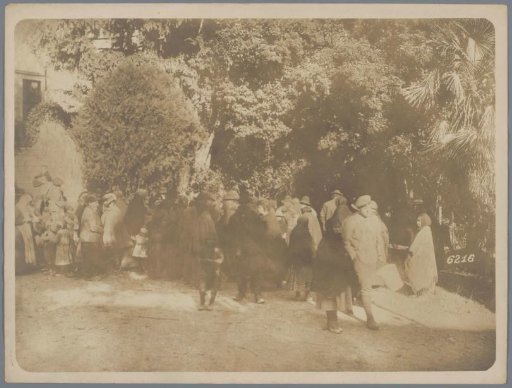 Civilians on a square with trees