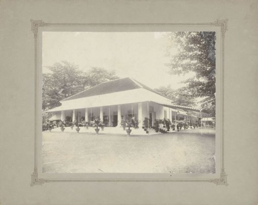 Villa with veranda and palms in Dutch East Indies