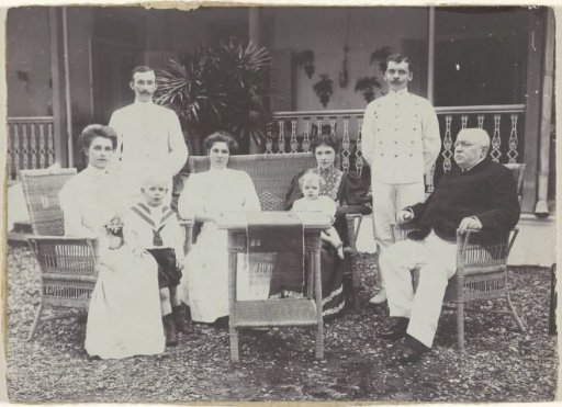Group portrait of an unknown family in a garden, Dutch East Indies