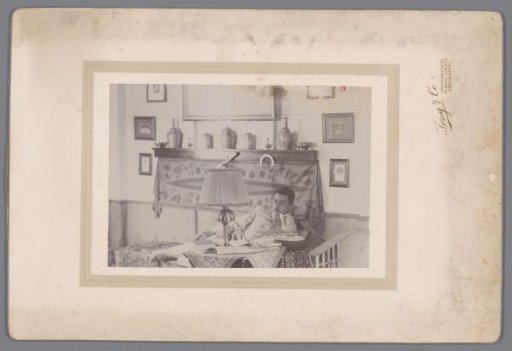 Portrait of an unknown man on a daybed