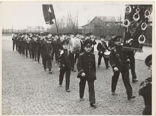 Amsterdam Post Harmonie marching on the street