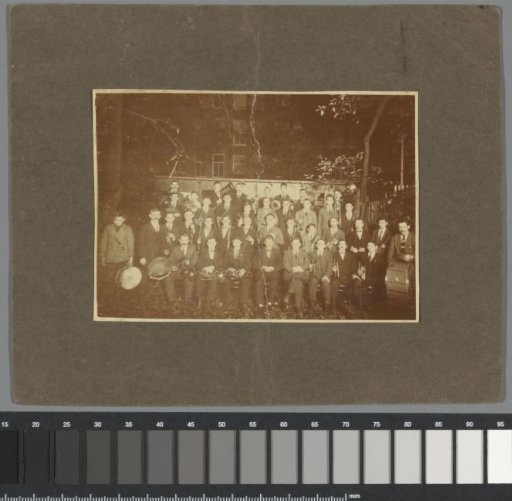 Group portrait of musicians, wind players, and drummers