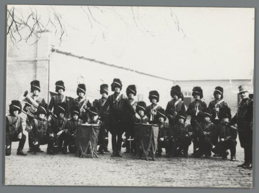 Group portrait of unknown members of the Corps of Mounted Artillery with musical instruments